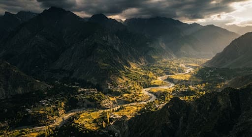 Green mountain ridges and a sunlit valley in the Karakoram
