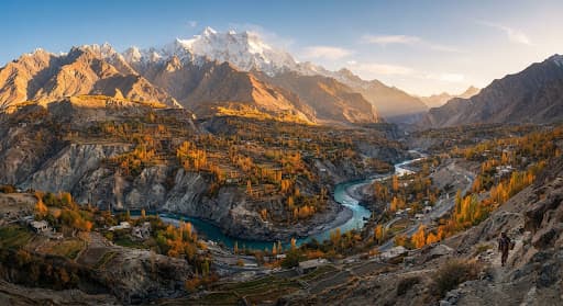 Sunrise over terraced slopes and high peaks in the Hunza valley